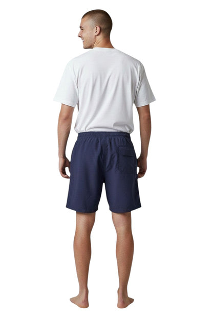 The Lifeguard Store navy blue polyester board shorts with liner and "STAFF" logo on back pocket.
