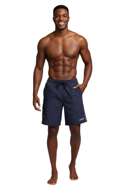 The Lifeguard Store navy blue polyester staff board shorts with elastic waistband, drawstring, and cargo pocket.
