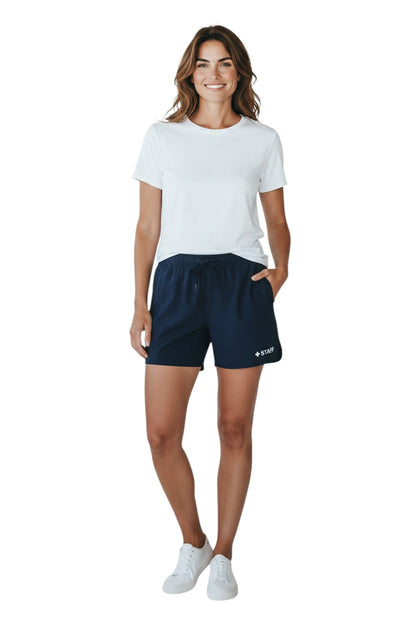 The Lifeguard Store navy blue polyester 5" inseam shorts with drawstring waist and "+ STAFF" logo.