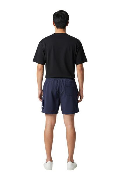 The Lifeguard Store navy blue polyester board shorts with liner, elastic waistband, drawstring, and cargo pocket. Features "SUPERVISOR" text.