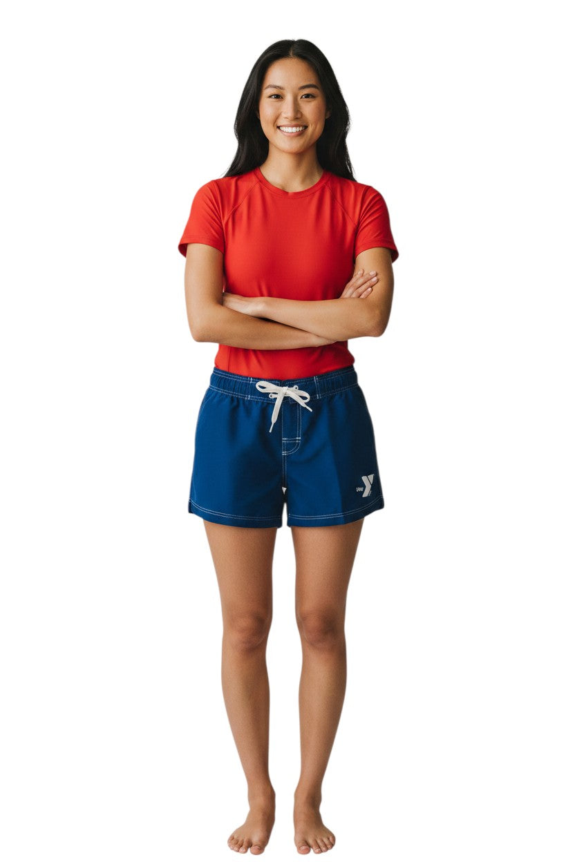 The Lifeguard Store navy blue polyester swim shorts with white drawstring, contrast stitching, and YMCA logo. 5" inseam.