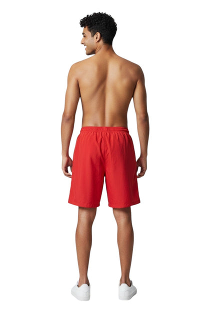 The Lifeguard Store red polyester board shorts with elastic waistband and drawstring. Features quick-dry fabric and UPF30+ protection.