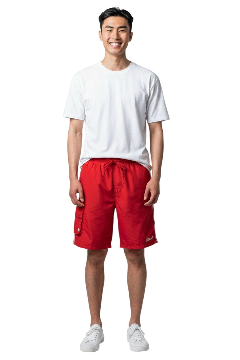 The Lifeguard Store red polyester board shorts with liner, elastic waistband, drawstring, and cargo pocket. Features white side stripe.