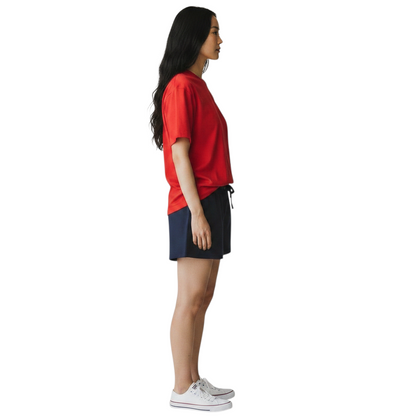 The Lifeguard Store red Dri-Fit short sleeve guard t-shirt worn by a woman in profile view