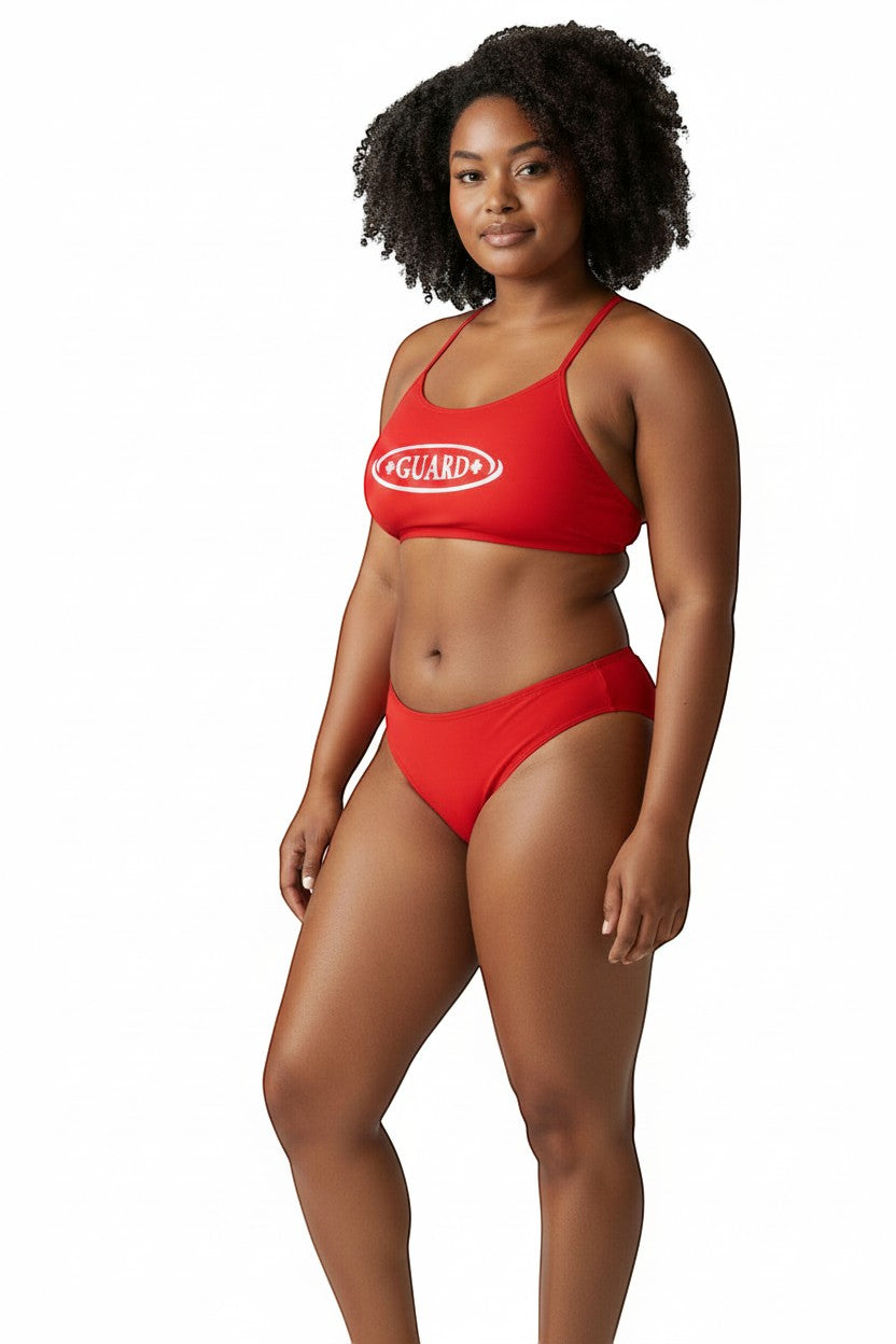 The Lifeguard Store red RISE Guard poly bikini with white Guard logo on a model against a white background