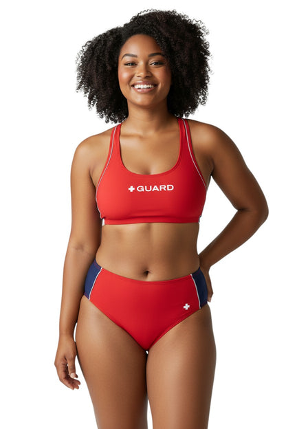 The Lifeguard Store red poly-stretch reversible guard racer back top with navy blue lining and white trim.