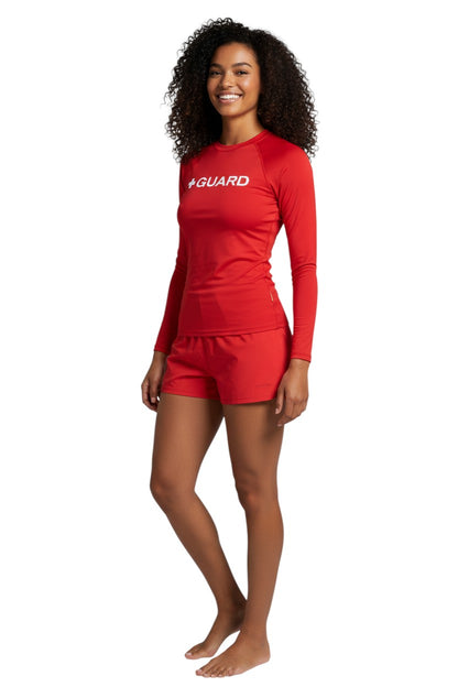 The Lifeguard Store red long sleeve crewneck rashguard with white + GUARD text on chest. Polyester-spandex blend.