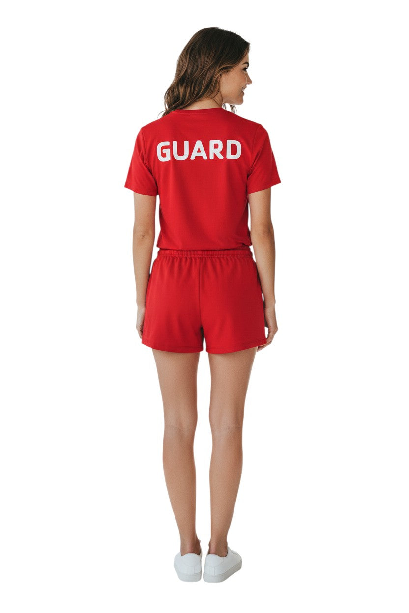The Lifeguard Store red short sleeve rashguard with "GUARD" printed on the back. Made of polyester and spandex.