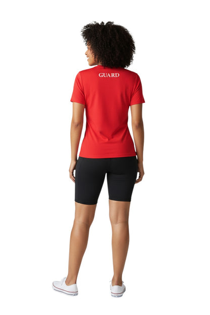The Lifeguard Store red short sleeve crew neck rashguard with GUARD text on back. Polyester-spandex blend.