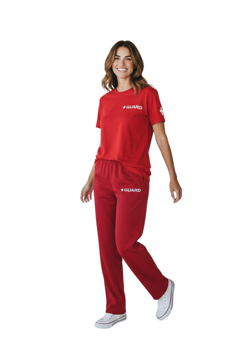 The Lifeguard Store red cotton polyester blend sweatpants with drawstring and side pockets, featuring a white "+ GUARD" logo.