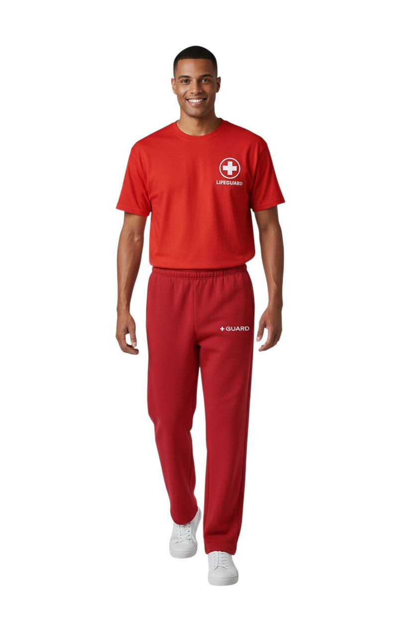 The Lifeguard Store red sweatpants with drawstring and side pockets, featuring a white "+ GUARD" logo.