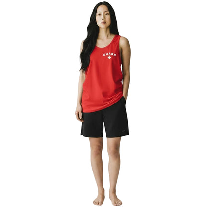 The Lifeguard Store red cotton tank top with white Guard logo worn by a woman with black shorts