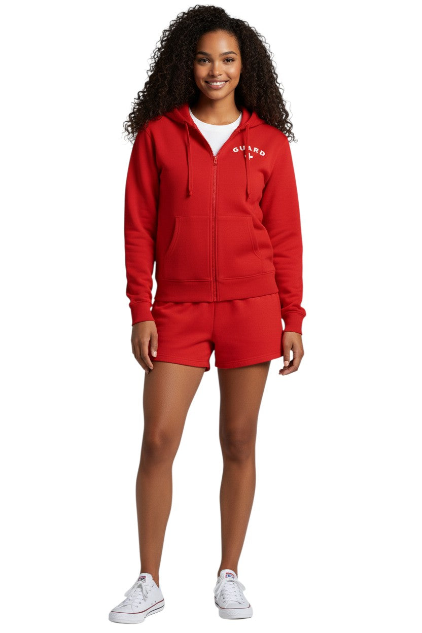 The Lifeguard Store red cotton polyester blend zip hoodie with white GUARD logo and cross on chest. Features a hood and pockets.