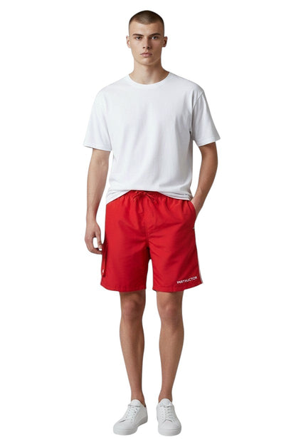 The Lifeguard Store red polyester board shorts with liner, elastic waistband, drawstring, and 7" inseam.
