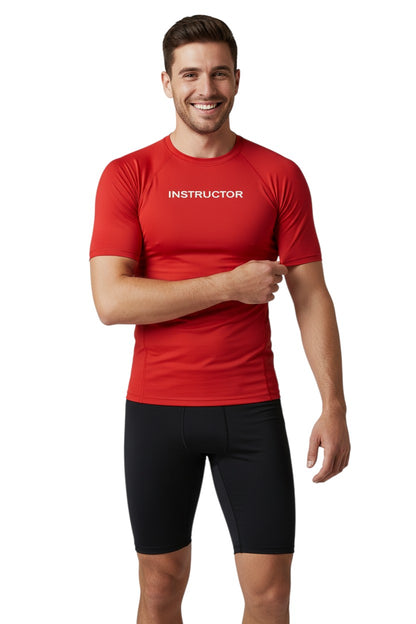 The Lifeguard Store red short sleeve rashguard with "INSTRUCTOR" printed on the chest. Made of 91% polyester and 9% spandex.