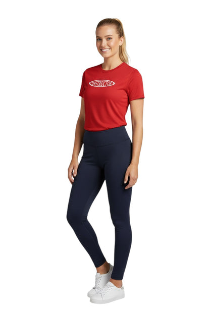 The Lifeguard Store red short sleeve rashguard with white 'INSTRUCTOR' oval logo on chest. Poly stretch fabric.