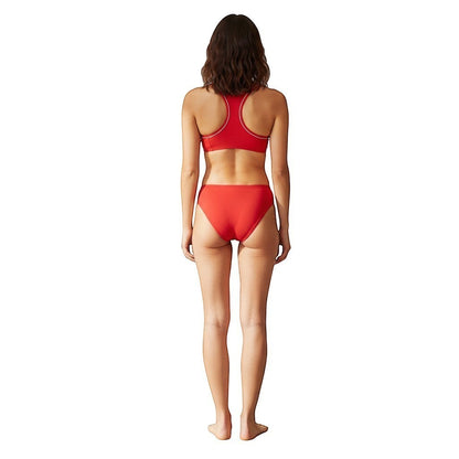 The Lifeguard Store red reversible racer back bikini top and matching bottoms on a model, back view.
