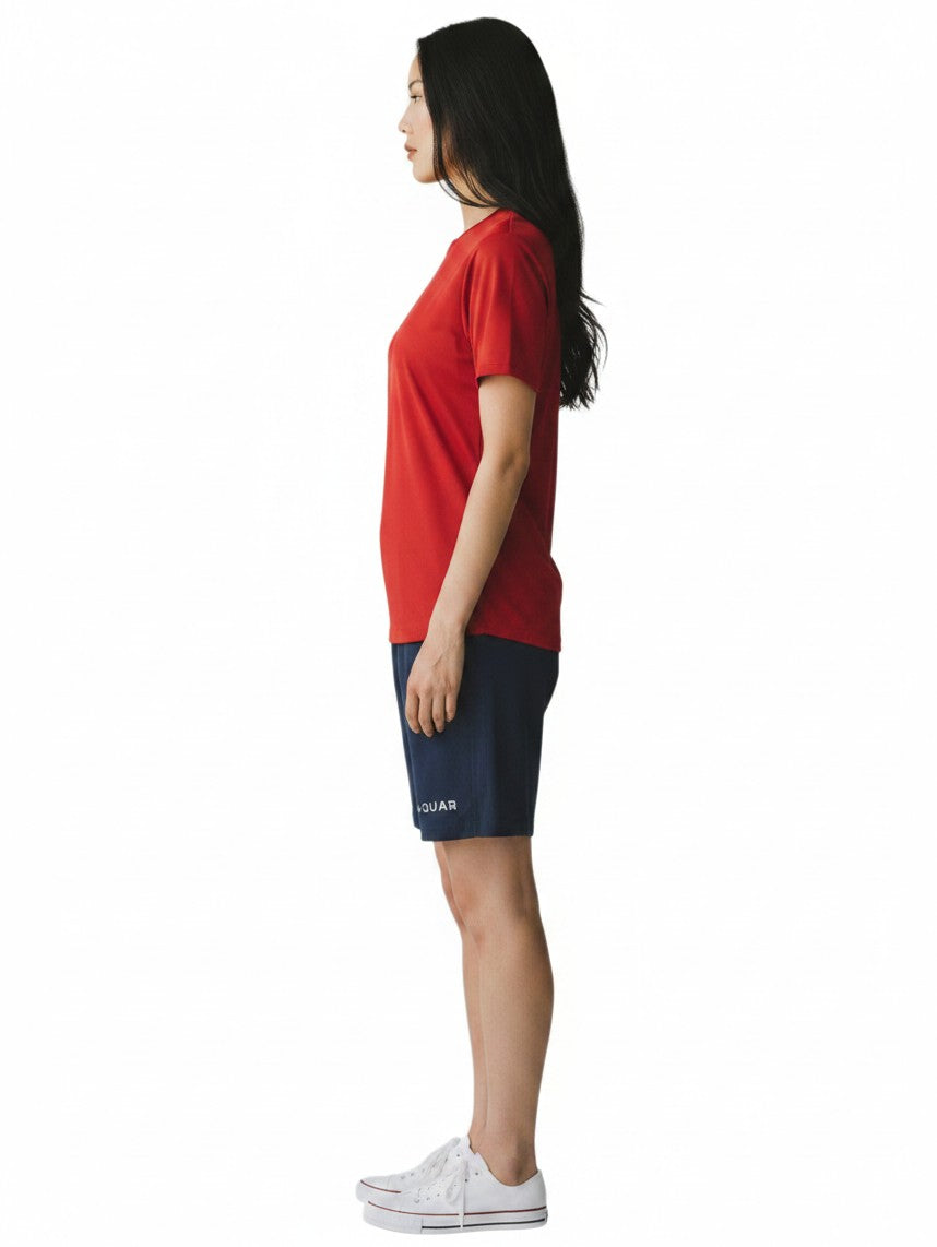 The Lifeguard Store RISE red short sleeve crew neck rashguard worn by a woman in profile view