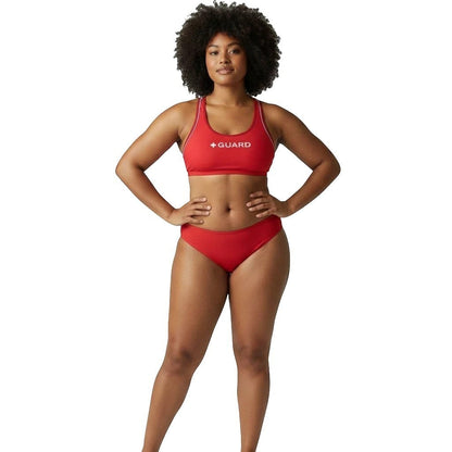 The Lifeguard Store red reversible racer back lifeguard bikini top with white GUARD text on a model