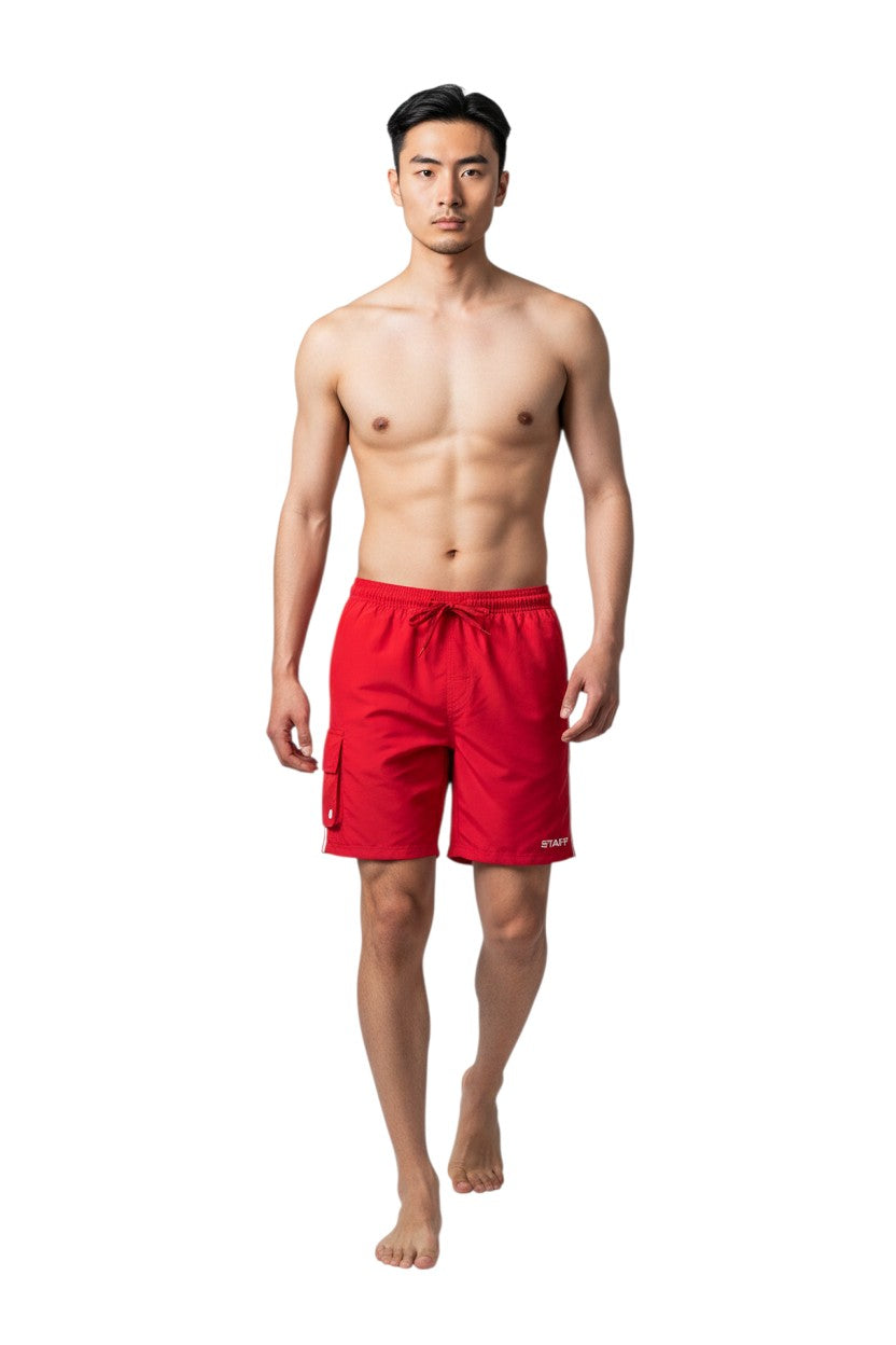 The Lifeguard Store red polyester board shorts with liner, elastic waistband, drawstring, cargo pocket, and "STAFF" logo.