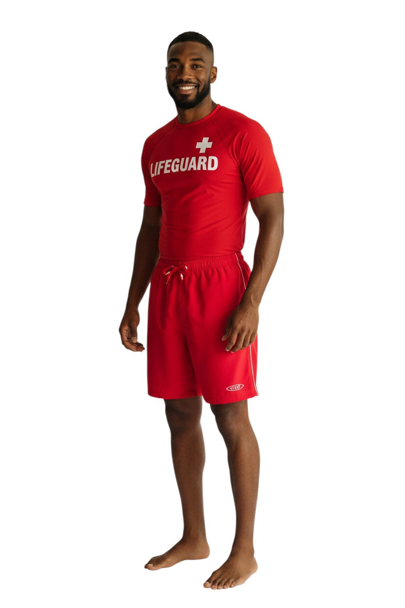 The Lifeguard Store red polyester board shorts with white piping and staff logo. Elastic waistband with drawstring.