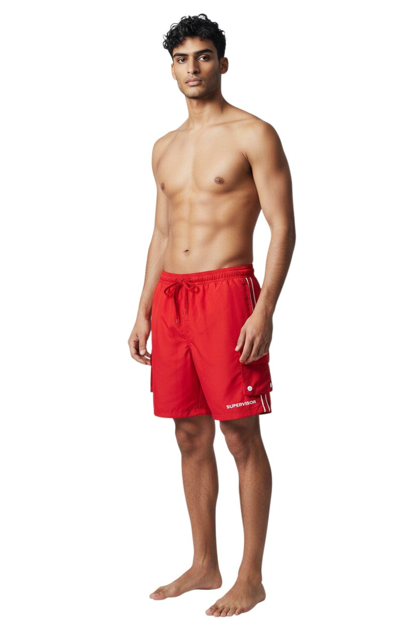 The Lifeguard Store red polyester board shorts with liner, elastic waistband, drawstring, and cargo pocket. Features UPF30+ protection.
