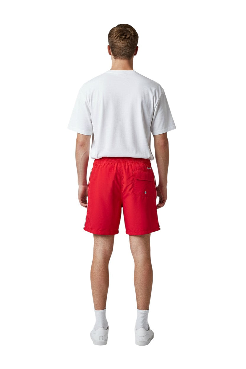 The Lifeguard Store red polyester board shorts with liner, elastic waistband, drawstring, and cargo pocket. Features "SUPERVISOR" text.