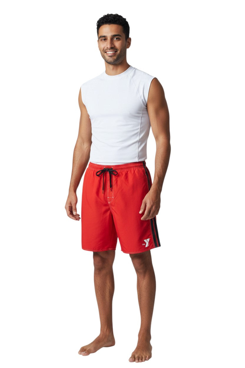 The Lifeguard Store red polyester YMCA board shorts with black side stripe, drawstring waist, and YMCA logo.