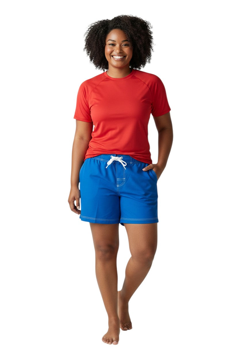 The Lifeguard Store RISE Solid Female Flex Short in royal blue polyester with white contrast stitching, drawstring waist, and side pocket.