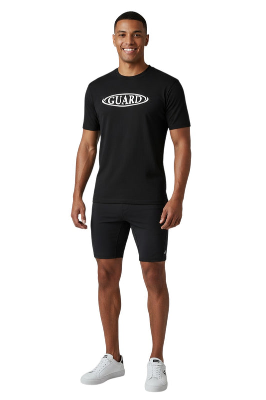 The Lifeguard Store RISE Guard black short sleeve crew neck rashguard with white oval logo on chest. Polyester-spandex blend.