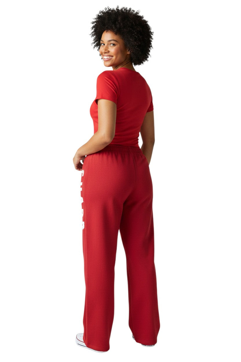 The Lifeguard Store RISE Guard red fleece sweatpants with white distressed logo down the leg. Cotton/polyester blend.