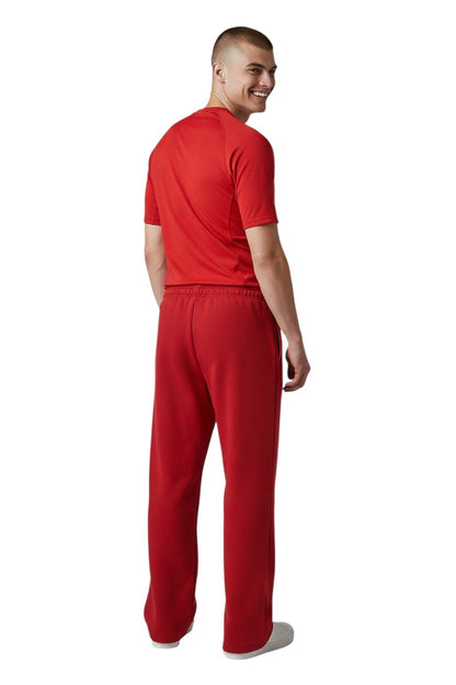 The Lifeguard Store RISE Guard red fleece sweatpants with white distressed "GUARD" logo down the left leg. Cotton/polyester blend.