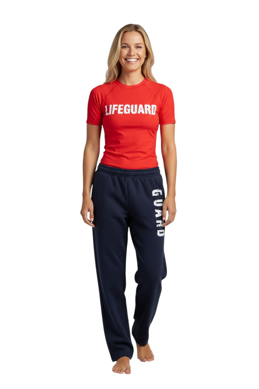 The Lifeguard Store RISE Guard Fleece Pants in navy blue with white "GUARD" logo down the leg. 50% Cotton/50% Polyester.