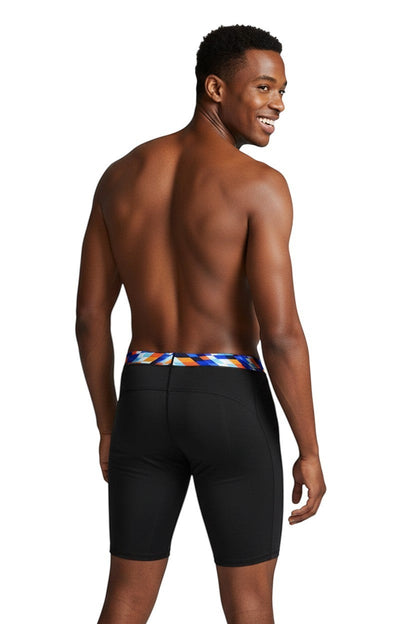 The Lifeguard Store RISE Sandies Swerve Poly Jammer swimsuit in black with a colorful geometric waistband. Made of 91% Polyester/9% Spandex.