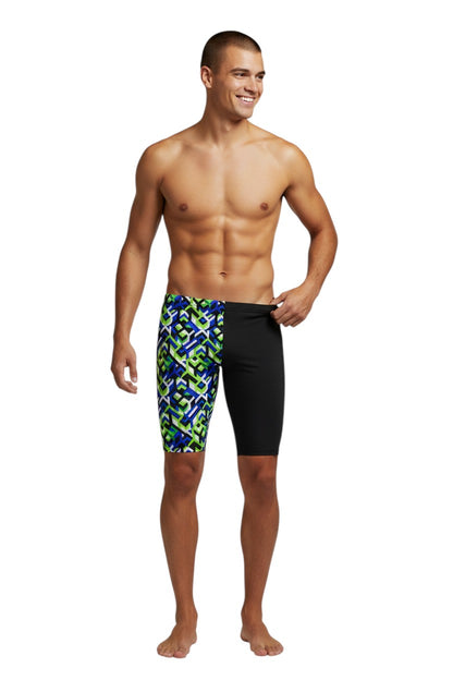 The Lifeguard Store RISE Sandies Breakout Poly Jammer swimsuit with geometric blue, green, and white pattern on left leg and black on right.