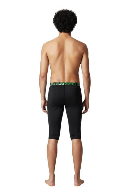 The Lifeguard Store RISE Sandies Helix Poly Jammer swimsuit in black with a green and white abstract pattern waistband. Made of Polyester/Spandex blend.