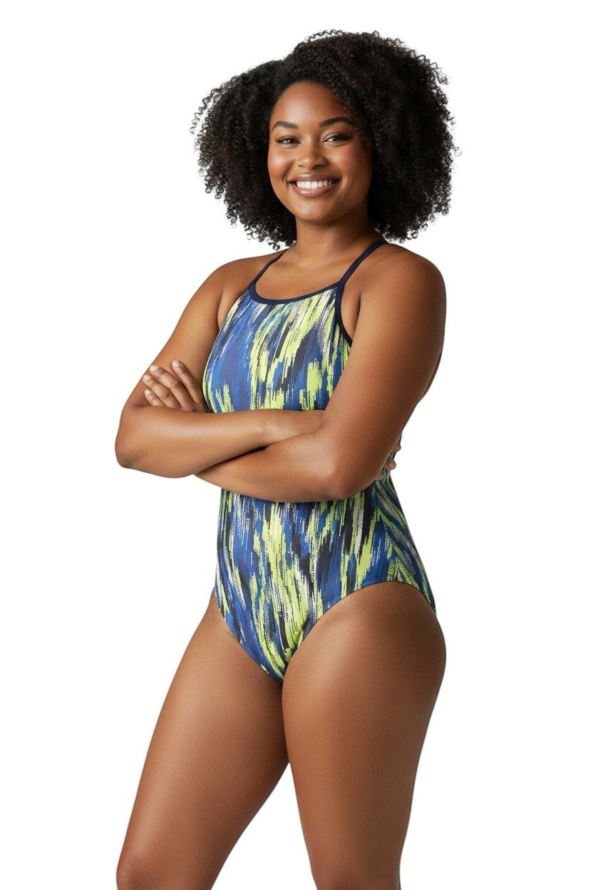 The Lifeguard Store RISE Sandies female shockwave poly swimsuit in blue, yellow, and black abstract print. Features thin straps and a high neckline.