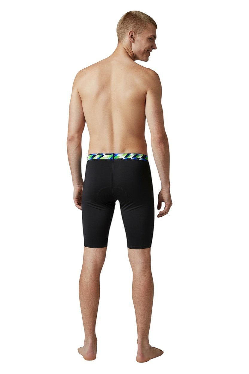 The Lifeguard Store RISE Sandies Swerve Poly Jammer swimsuit in black with a geometric waistband in blue, green, and white. Made from 91% Polyester/9% Spandex.