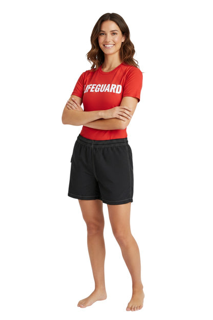 The Lifeguard Store RISE Solid Flex black polyester-spandex board shorts with 3" inseam, elastic waistband, and side pocket.