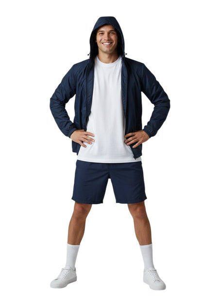 The Lifeguard Store RISE Solid Waterproof Jacket in navy blue, made of polyurethane with a full zip, adjustable hood, and heat-sealed seams.