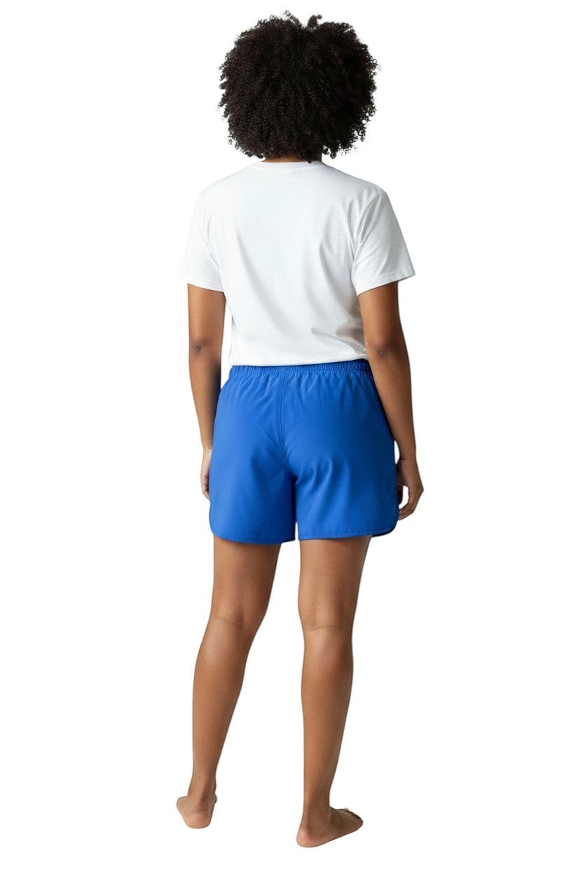 The Lifeguard Store women's royal blue polyester 5" inseam instructor shorts with drawstring waist and white logo.