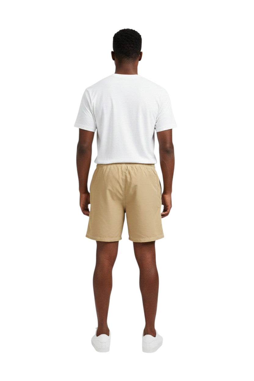 The Lifeguard Store Solid Male Flex Short in tan, made of polyester and spandex blend, with elastic waistband and velcro pocket.