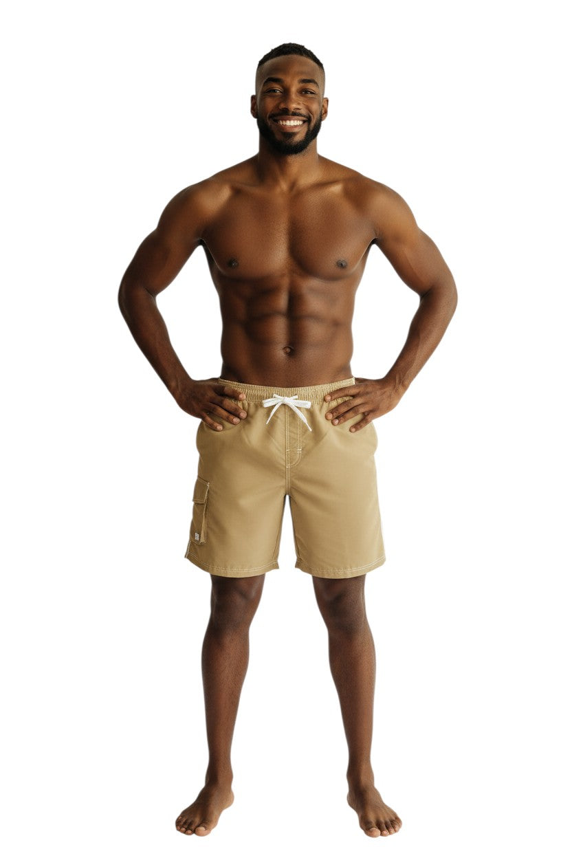 The Lifeguard Store Solid Male Flex Short in tan polyester with white drawstring, contrast stitching, and side pocket.