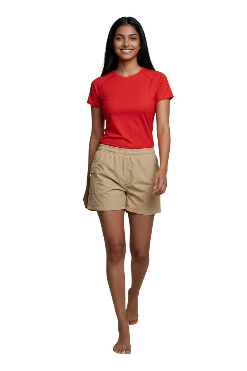 The Lifeguard Store RISE Female Solid Board Short in tan nylon with elastic waistband and side pocket. 3" inseam.