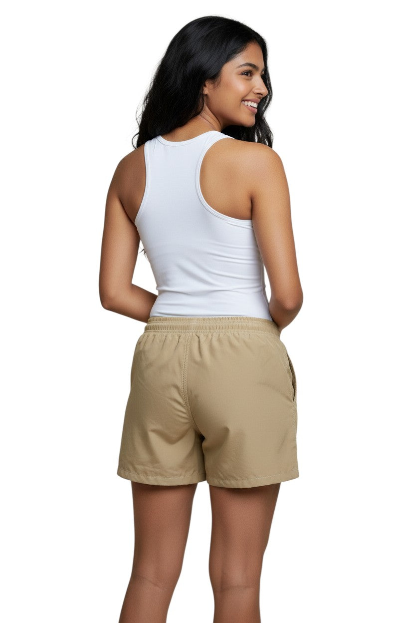The Lifeguard Store RISE Female Solid Board Short in tan nylon with elastic waistband, drawstring, and side pocket. 3" inseam.