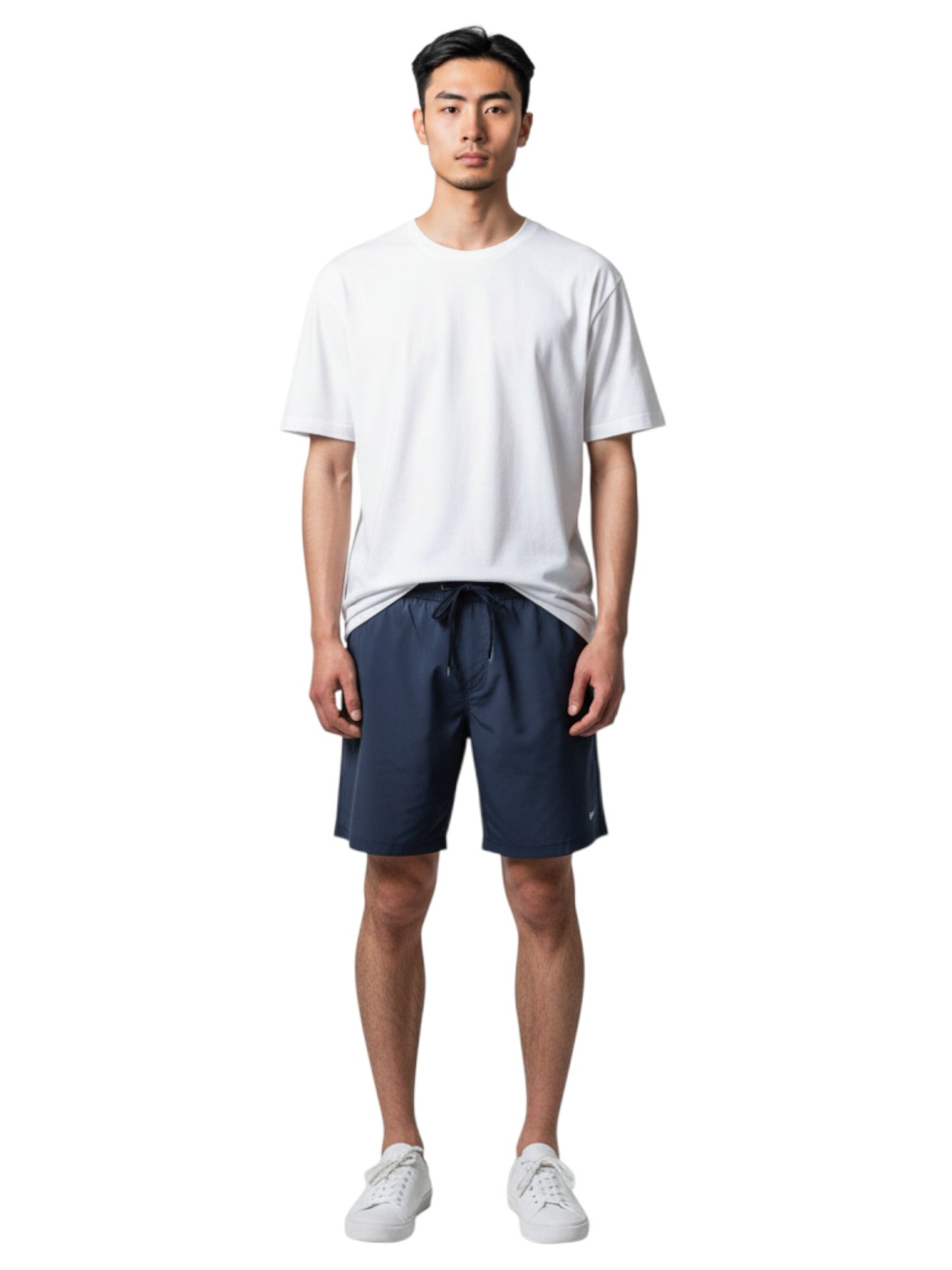 Male model wearing The Lifeguard Store white short sleeve crew neck rashguard and navy blue swim shorts