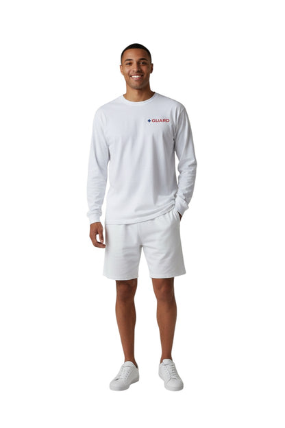The Lifeguard Store white 100% cotton long sleeve tee with red and blue "GUARD" logo on the left chest.