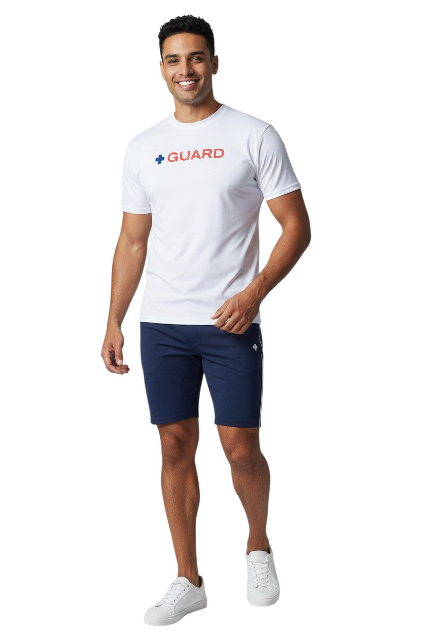 The Lifeguard Store white short sleeve crewneck rashguard with blue and red GUARD text graphic.