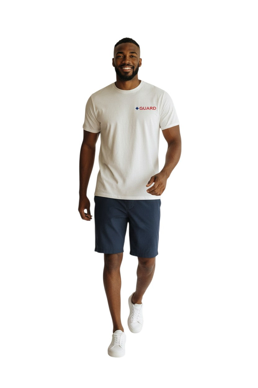 The Lifeguard Store white 100% cotton short sleeve tee with blue and red GUARD logo on chest.
