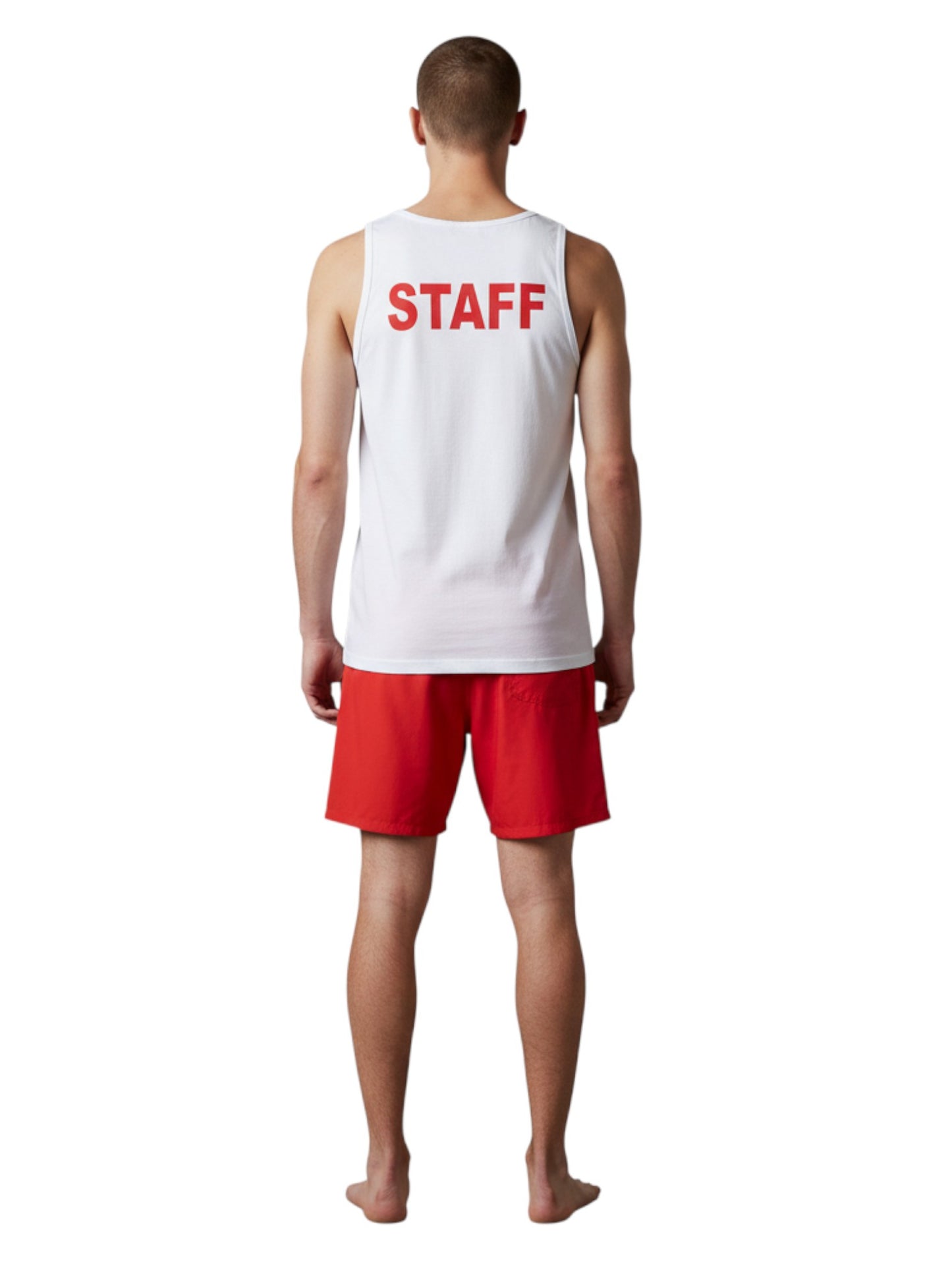 The Lifeguard Store white cotton staff tank top with red STAFF lettering on the back, worn by a man with red shorts.